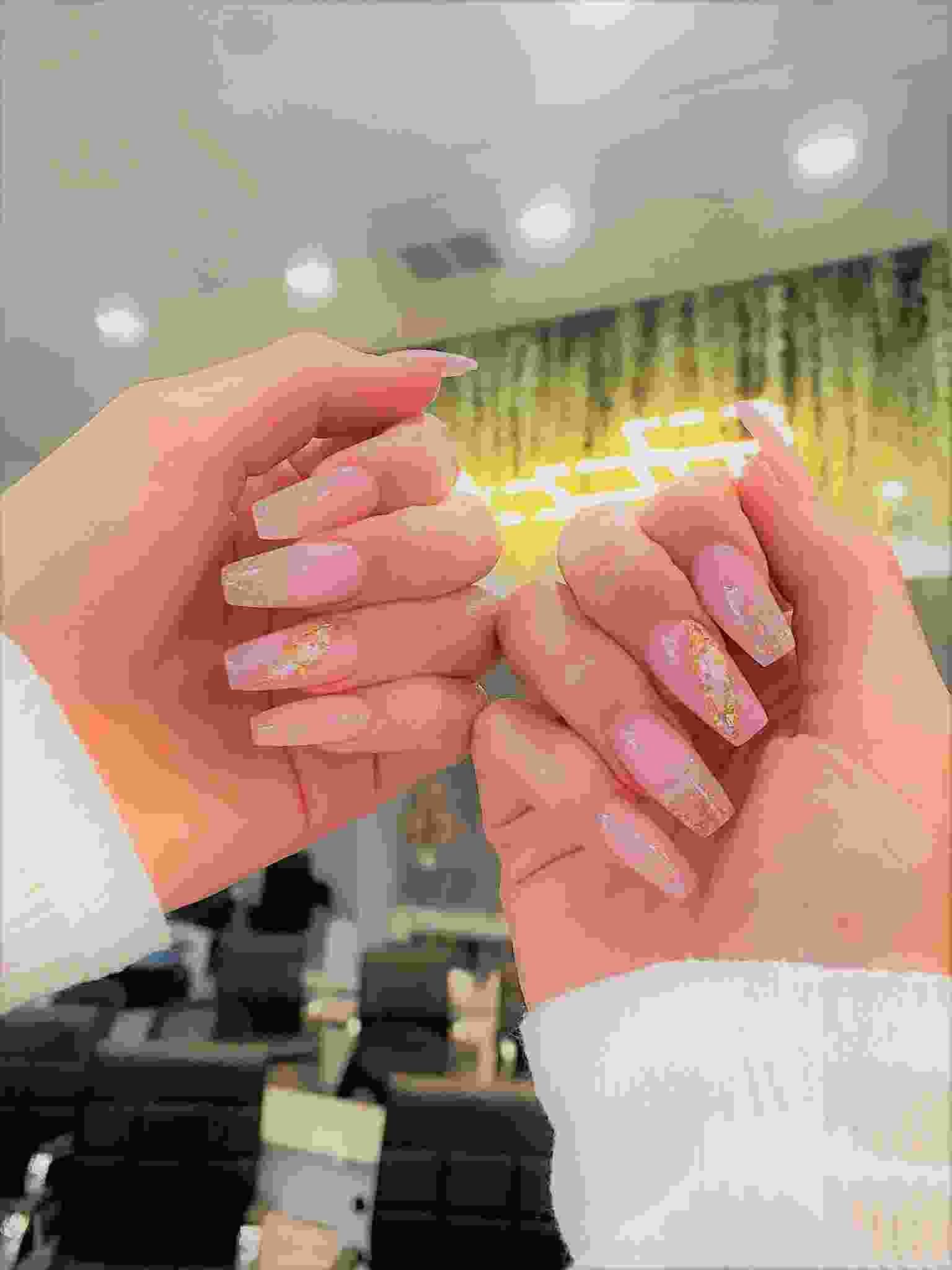 Hand-finished nail art by a T&L Nails technician